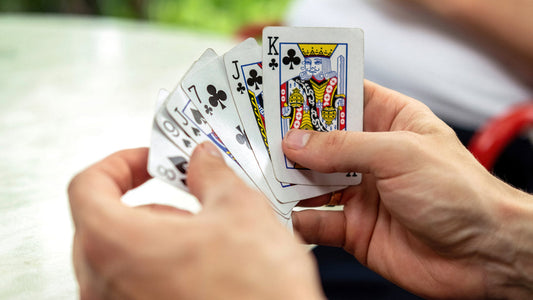Hands holding cards